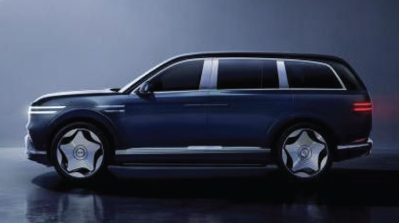 Side view of a dark blue luxury SUV with chrome accents, star-spoked wheels, and distinctive horizontal headlights/taillights.