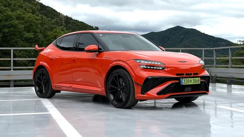 The 2027 Genesis GV60 Magma features 641 horsepower, a lowered stance, wider fenders, and distinctive orange brake calipers.